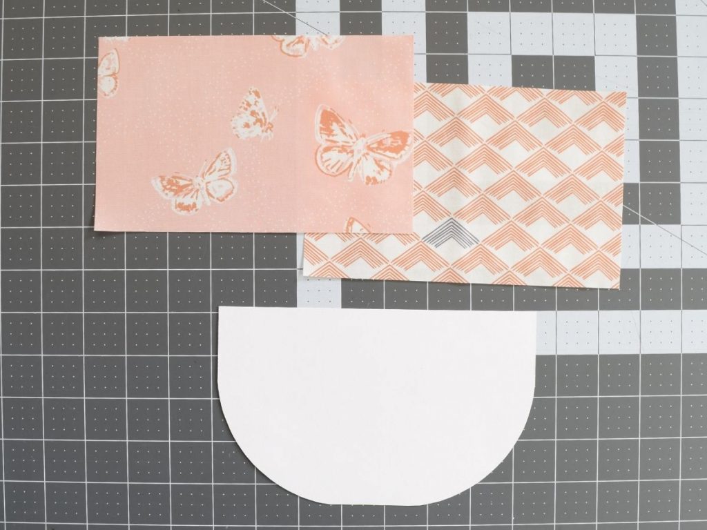 two piece of fabric and a cardstock template
