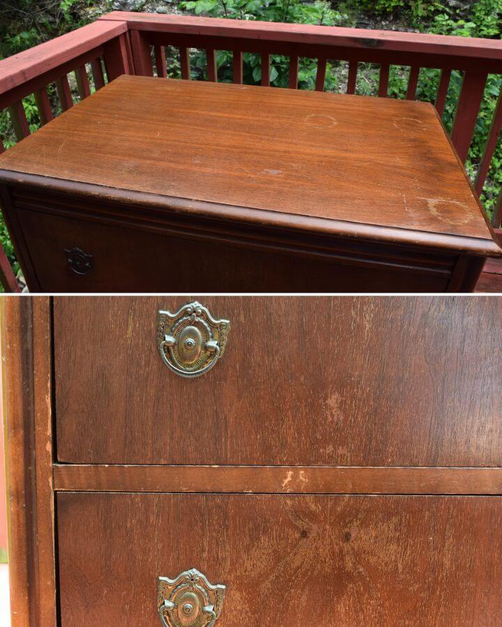 Old wood dresser with water rings and chipping finish